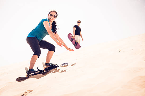 Sandboarding in Merzouga desert Erg Chebbi Morocco