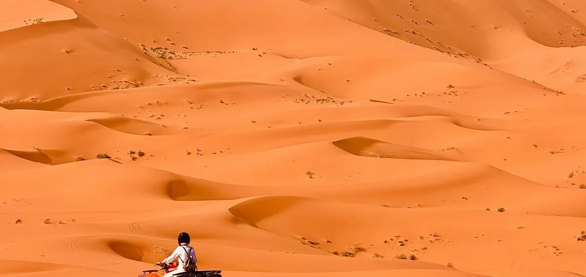 Quad biking in the Erg Chebbi dunes during a 2 days desert tour from Marrakech to Fes via Merzouga.