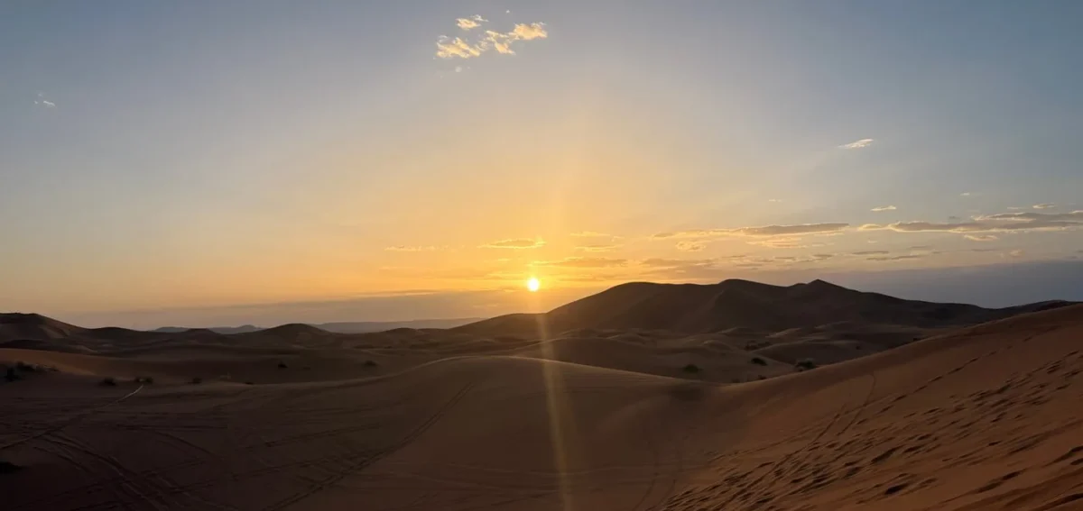 Sunset over the Erg Chebbi dunes during a 2 days desert tour from Marrakech to Fes via Merzouga.