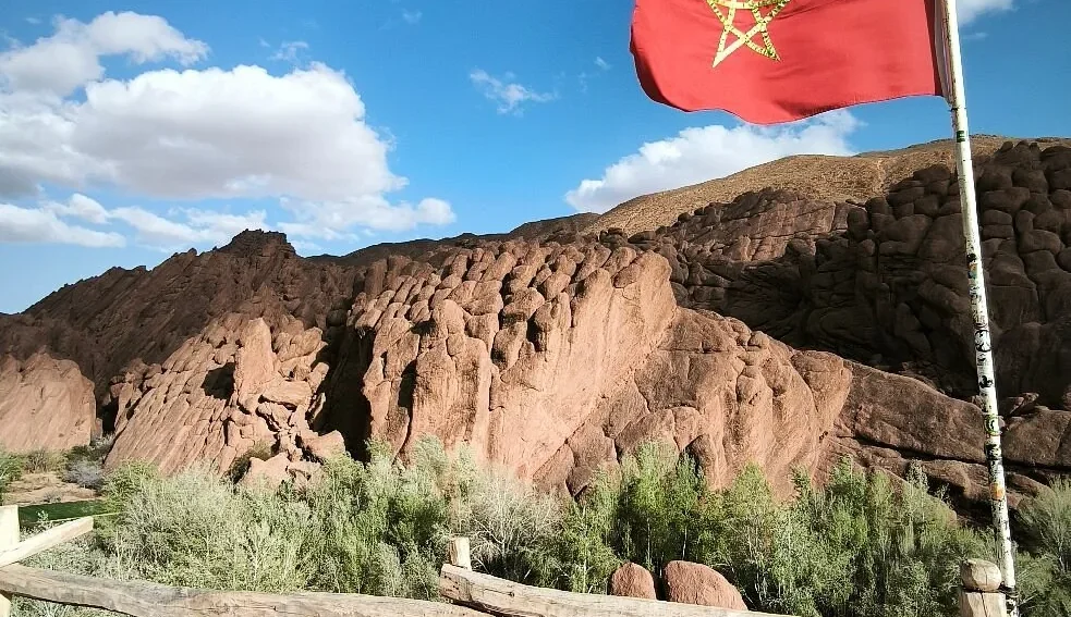 Morocco flag in Dades Valley during the 7 days desert tour from Marrakech to Fes via Merzouga