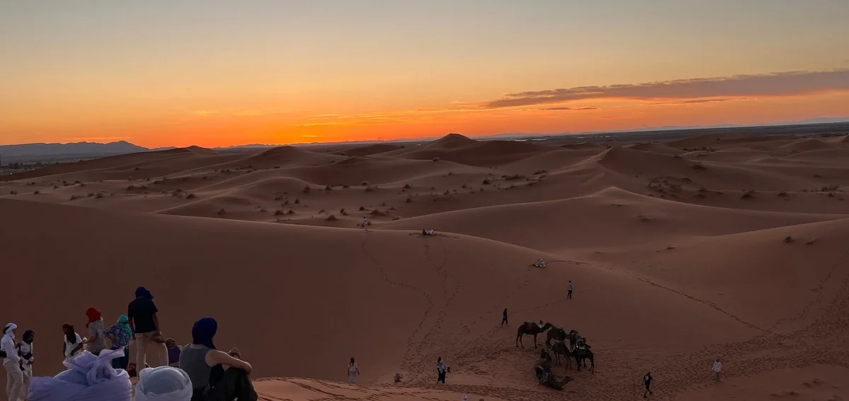 Sunset over the Erg Chebbi dunes during the 8 days Morocco desert tour from Marrakech