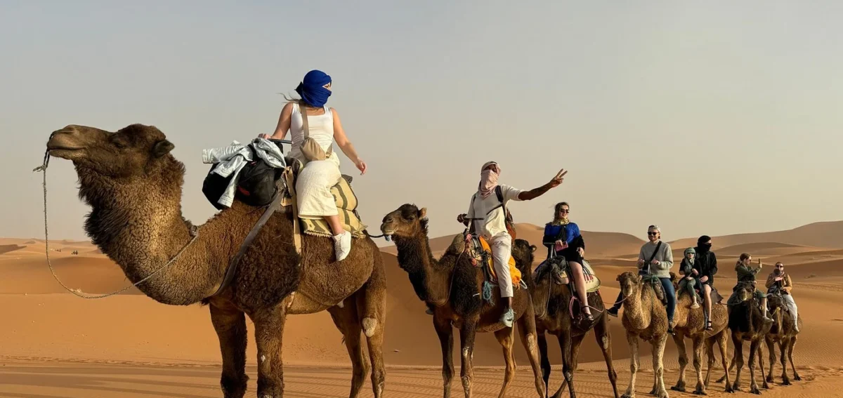Camel caravan in the Erg Chebbi dunes during a 7 days Morocco tour from Casablanca to Marrakech