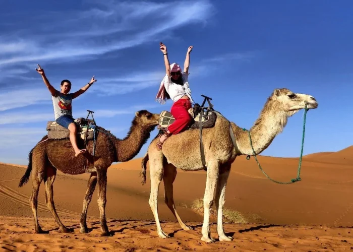 Camel ride in the Erg Chebbi dunes during a 7-day Morocco tour from Casablanca to Marrakech