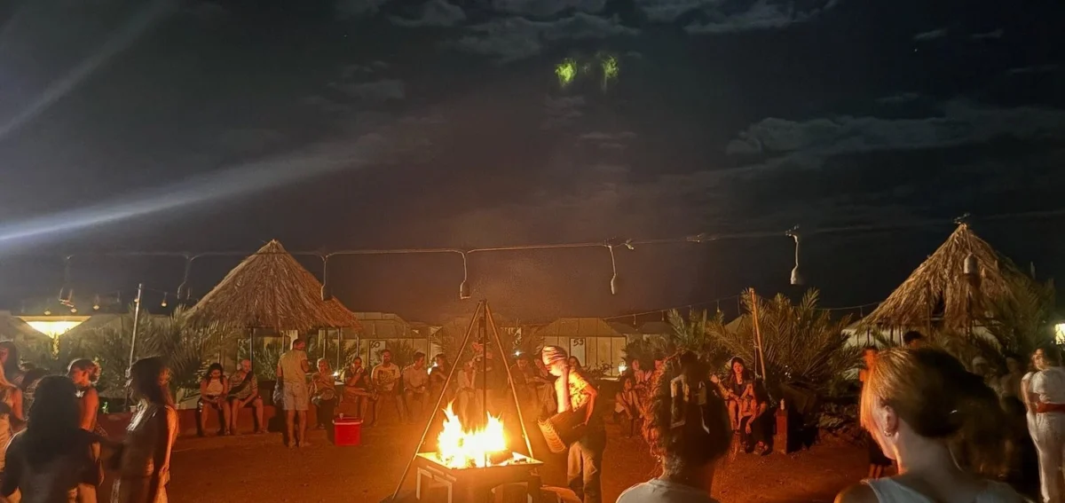 Campfire night at a Merzouga desert camp during the 8 days Morocco desert tour from Marrakech