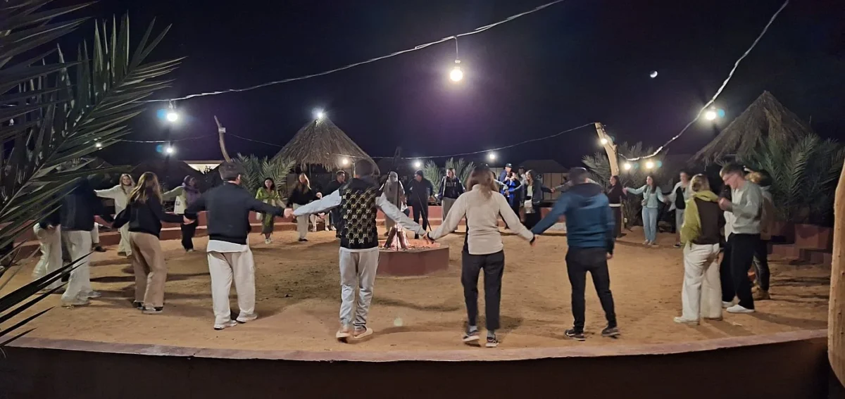 Traditional music and dancing at a Merzouga desert camp during a 3-day tour from Fes