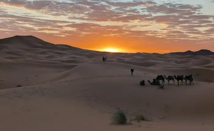Sunset over the Erg Chebbi dunes near Merzouga on a 3 days desert tour from Fes to Marrakech