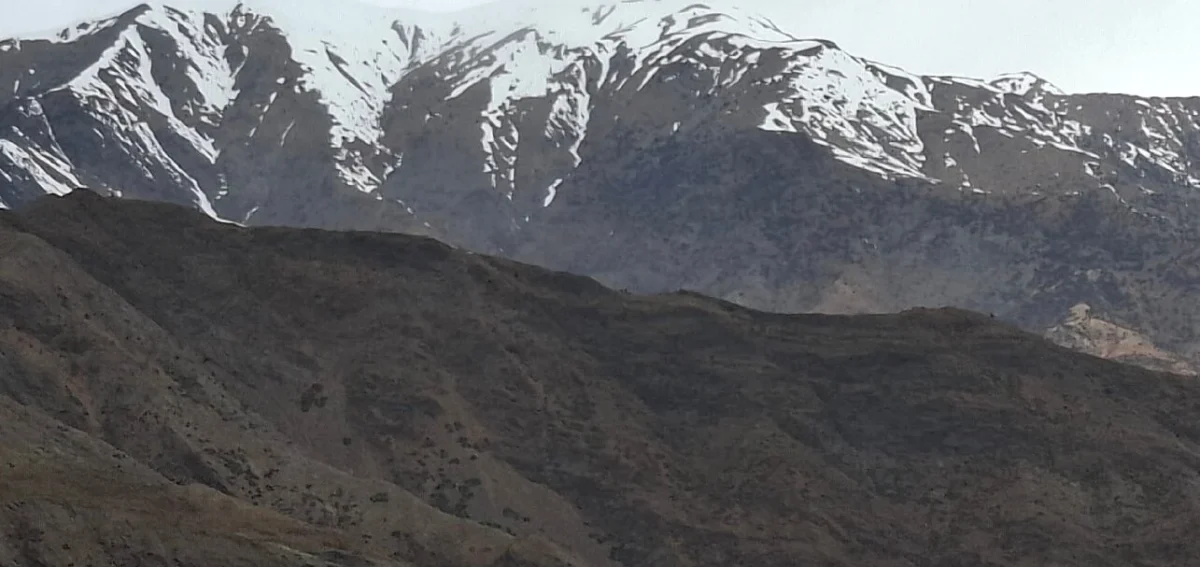 Snow-covered High Atlas Mountains on the final day of the 4-day Agadir to Merzouga desert tour ending in Marrakech