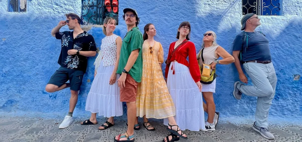 Travelers in Chefchaouen blue city during a 9-day Morocco tour from Tangier