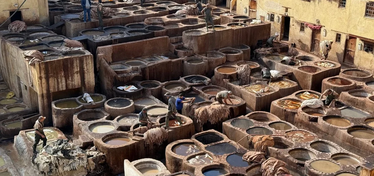 Traditional leather dyeing vats at Chouara Tannery in Fes Medina