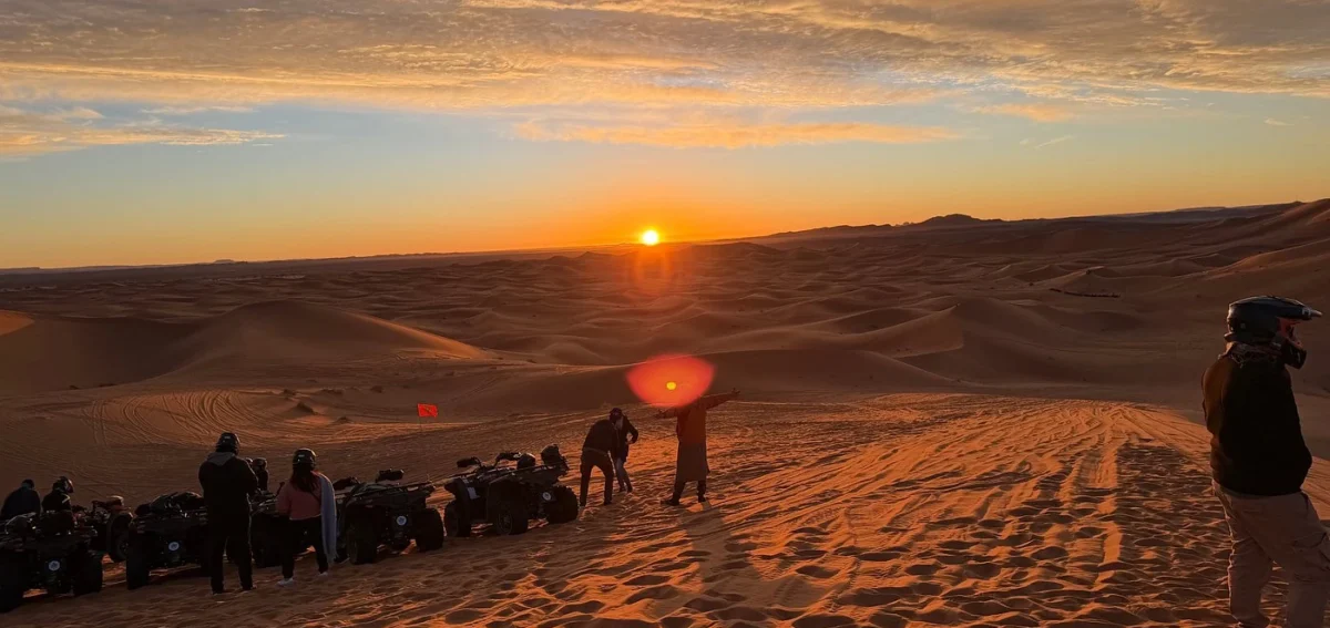 Quad biking at sunset in Merzouga during a 9-day Morocco tour from Tangier