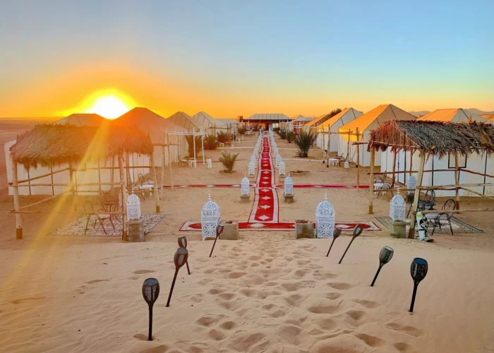 Merzouga Sahara desert camp at sunset during a 7 days Morocco tour from Rabat to Marrakech.