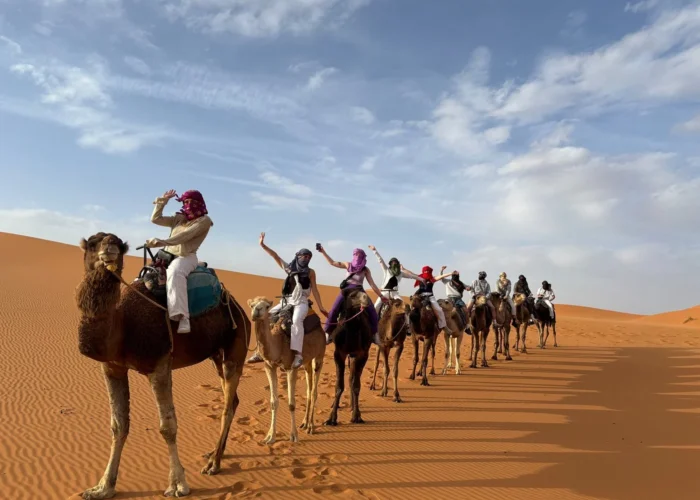 Camel trekking in Erg Chebbi dunes during a 4 days desert tour from Rabat to Marrakech.